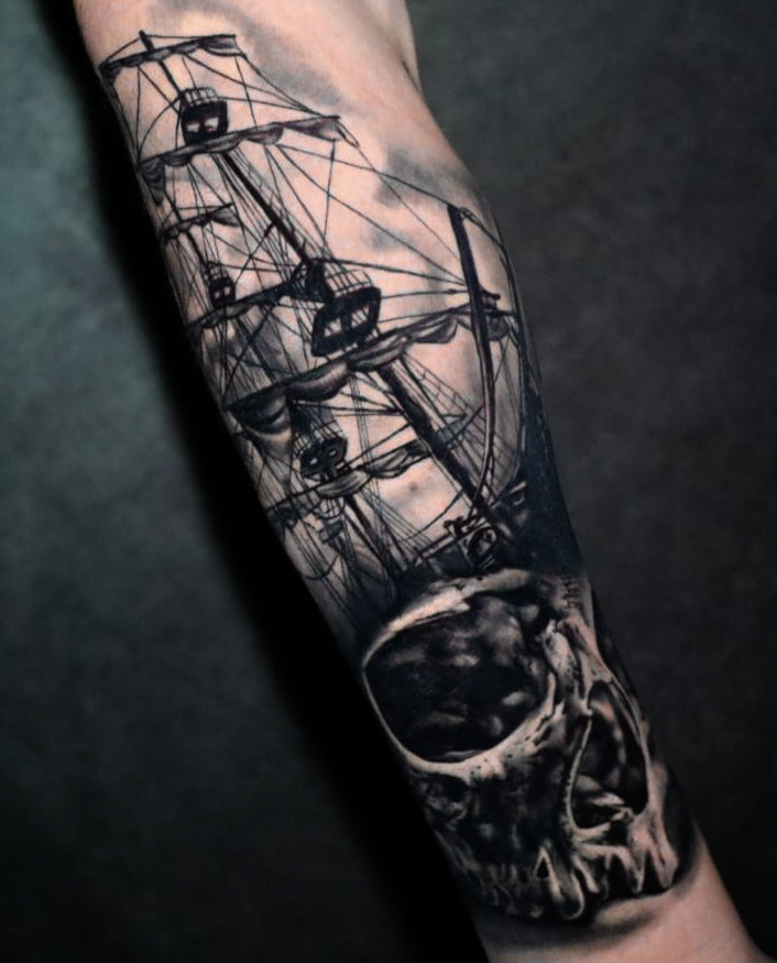 black and grey realistic pirate ship with skull tattoo