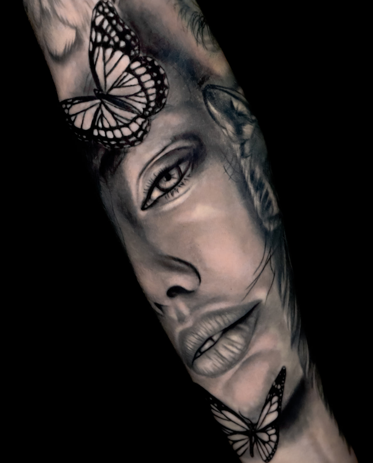 woman portrait with butterflies tattoo